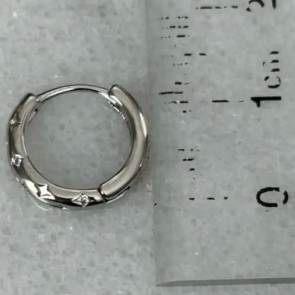 Sterling Silver Star Crystal Pave Hoop Earrings

Brand New - Picture 4 of 5